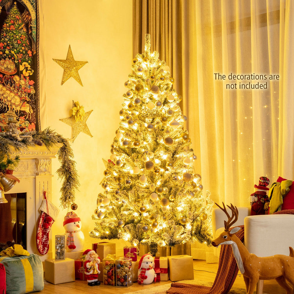 6-foot pre-lit snow flocked Christmas tree with 928 tips and metal stand, perfect for creating a warm festive.