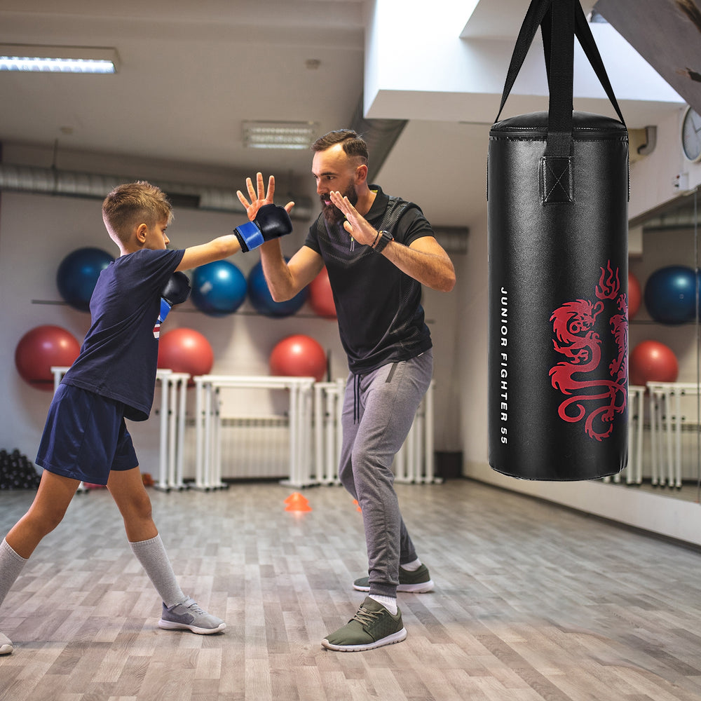 Kids boxing set featuring a punch bag, gloves, and skipping rope, ideal for children's workouts and fitness training.