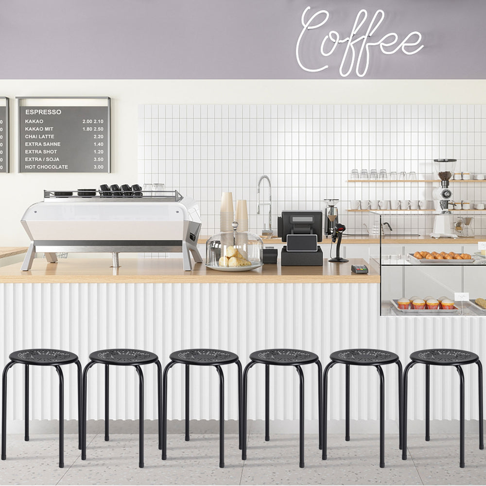 Set of 6 black backless round metal stools with daisy design, ideal for indoor and outdoor use, stackable for storage.
