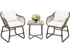 Two cushioned rattan chairs and a glass table in a patio setting, perfect for outdoor relaxation and leisure time.