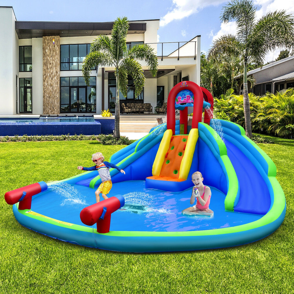 Inflatable waterslide bounce house with two slides, climbing wall, and splash pool for outdoor fun in the backyard.