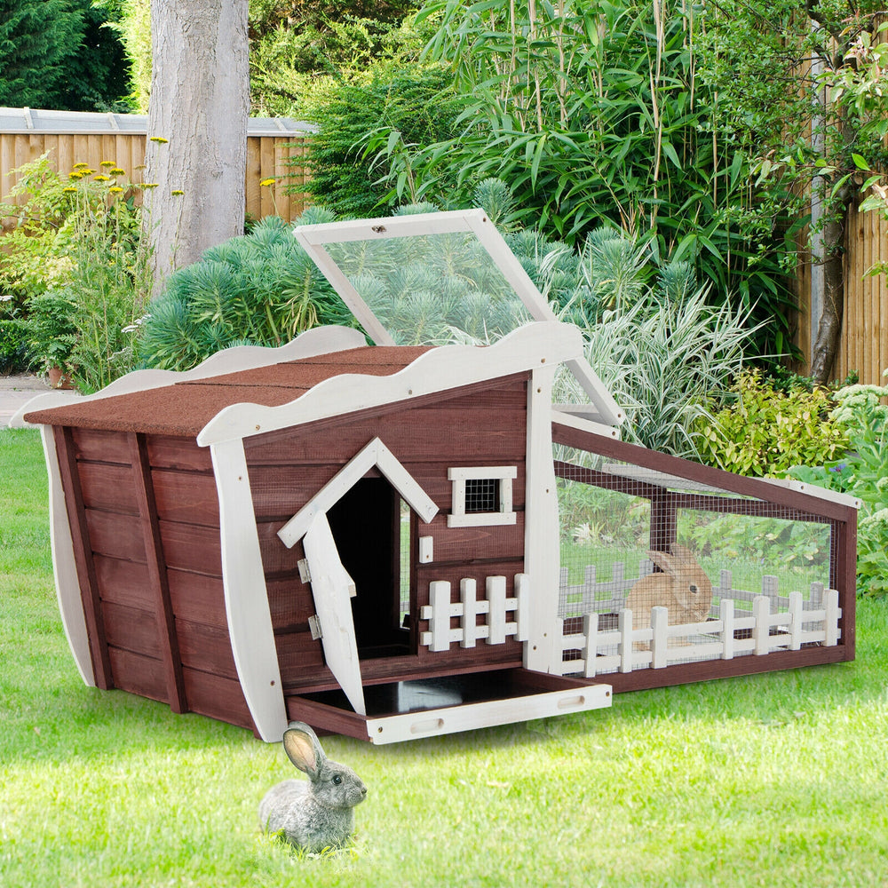Wooden rabbit hutch with pull-out tray in red, featuring a cozy resting area and weather-resistant roof for outdoor use.