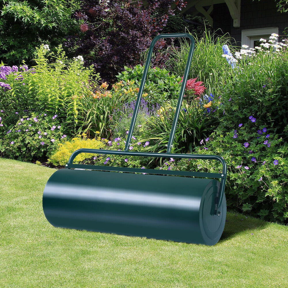 Green 24 x 13 inch metal push lawn roller with foldable handles, ideal for leveling soil and packing down seed.