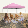 Pink 10 x 10 feet outdoor instant pop-up canopy set up on the beach, ideal for picnics and gatherings with friends.