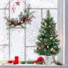 3 FT battery-operated tabletop Christmas tree in a silver bucket with warm-white lights, red berries, and pine cones.