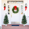 3 FT battery-operated tabletop Christmas tree with warm-white LED lights, adorned with red berries and frosted pine.