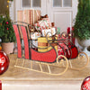 Red metal Christmas sleigh decoration with two-tier storage, perfect for displaying gifts indoors or outdoors.