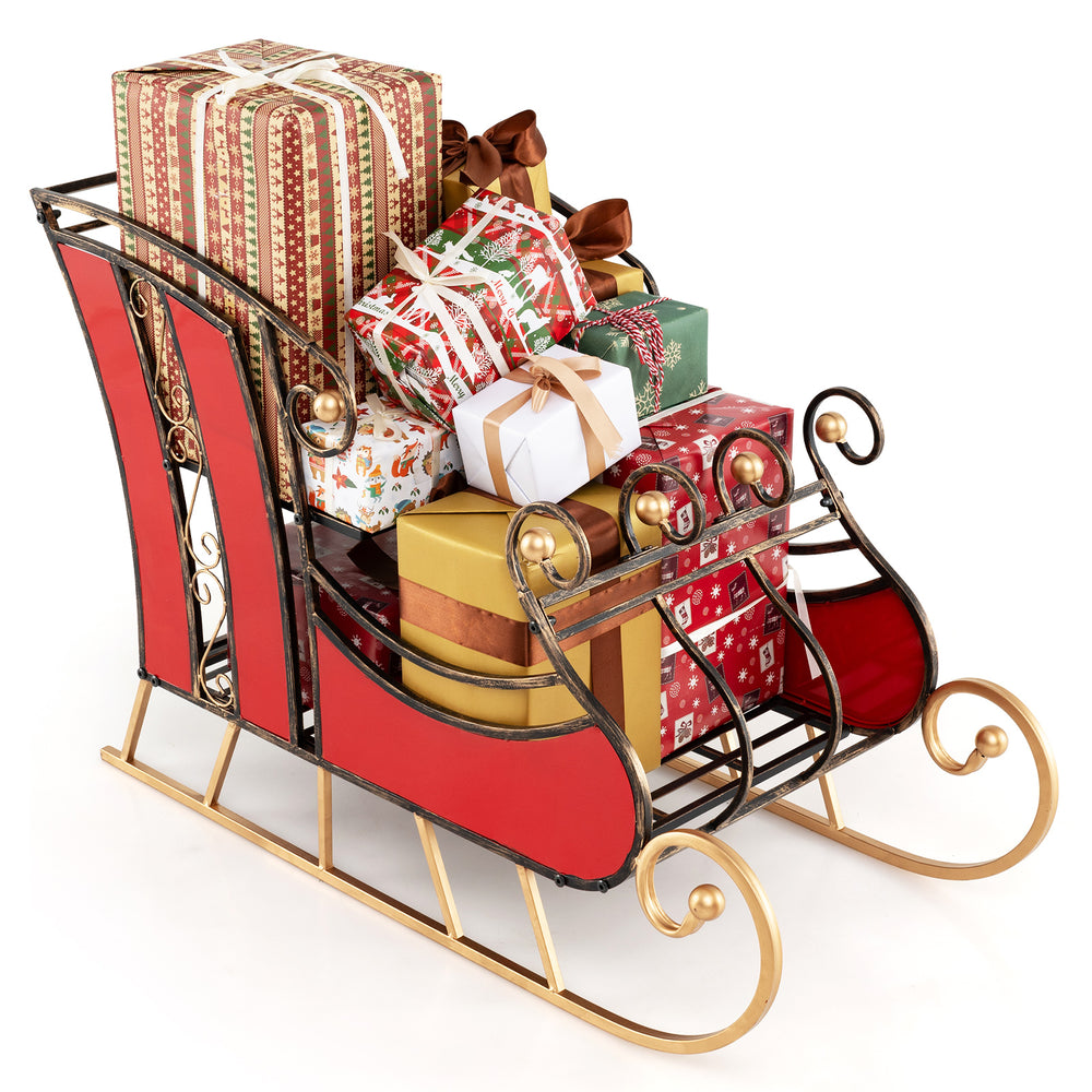 Christmas metal sleigh decoration with vibrant red body and gold scrollwork, featuring 2-tier storage for gifts.