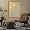 Three-globe floor lamp with golden finish, featuring acrylic shades and foot switch, perfect for home or cafe lighting.