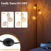 3-globe floor lamp with foot switch, golden finish, featuring acrylic shades for soft light diffusion in homes or cafes.