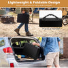 3-height folding camping table in black with a practical handle, shown being carried for easy transport.