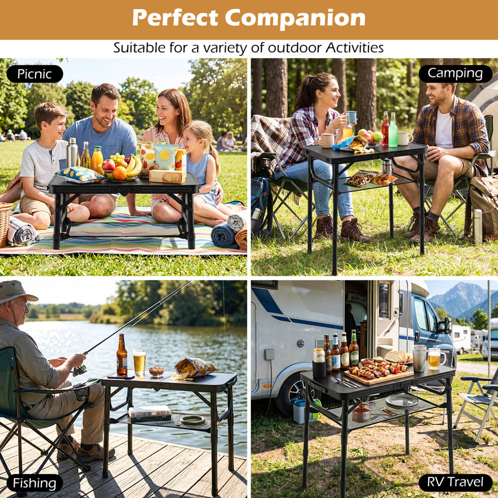 Folding camping table in black with large storage net, ideal for picnics, camping, and RV travel activities.