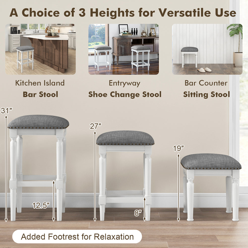 Three heights of gray padded saddle stools with footrests, perfect for kitchen, entryway, or bar counter use.