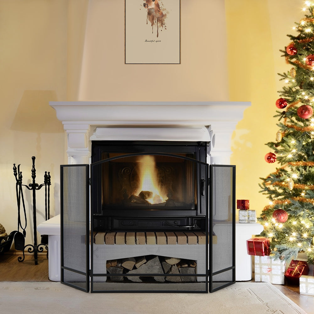 Black 3-panel foldable fireplace screen with wrought metal mesh, providing safety for kids and pets in the living room.