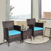 Two blue-cushioned rattan chairs and a glass-top coffee table in a cozy indoor setting, ideal for outdoor relaxation.