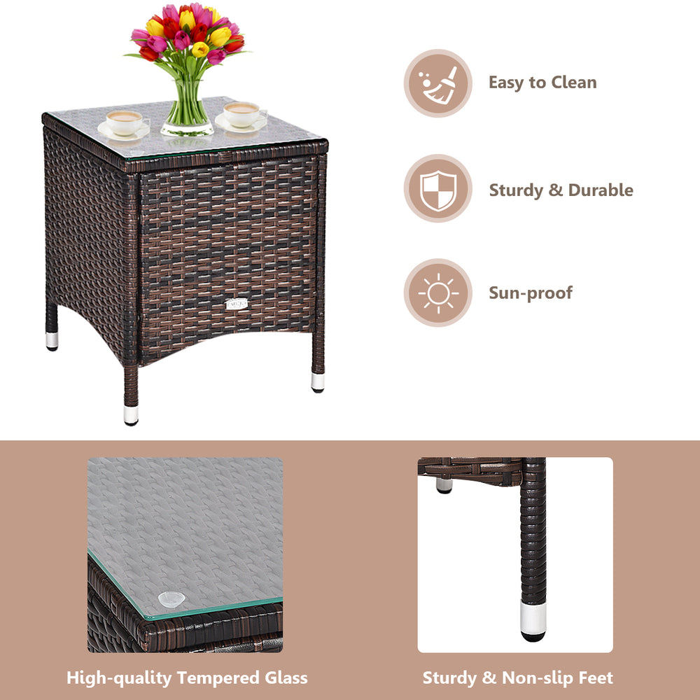 Rattan coffee table with tempered glass top, part of a 3-piece outdoor furniture set, ideal for patio relaxation.