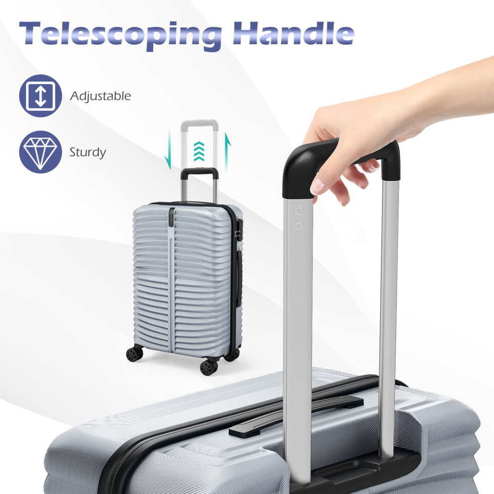 Telescoping handle of a gray hardside suitcase from a 3-piece luggage set, showcasing its sturdy and adjustable design.