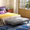 Convertible folding futon sofa bed in gray with padded cushions, perfect for relaxation and extra sleeping space.