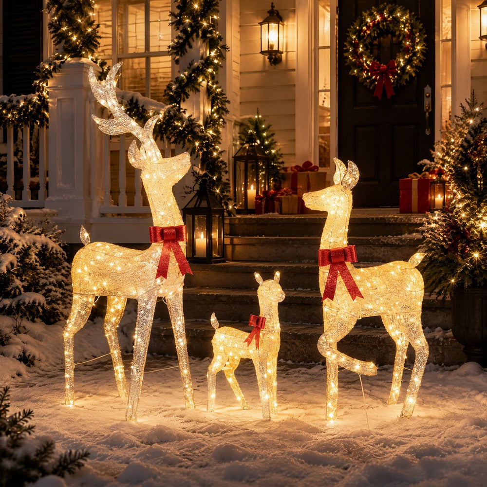 Lighted golden Christmas reindeer family set with 280 LED lights, festive bows, and sturdy metal frames for outdoor display.