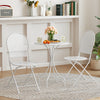 White 3-piece metal bistro set featuring a round table and two folding chairs, perfect for indoor or outdoor use.