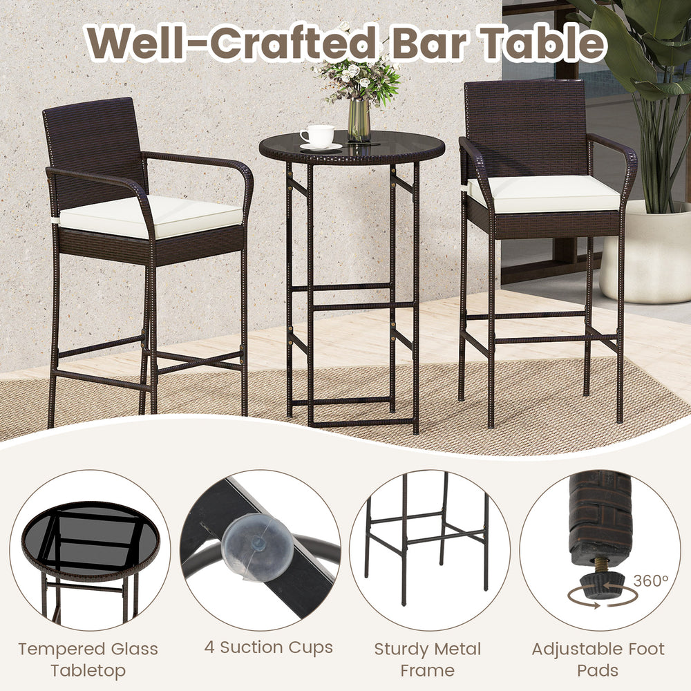 Outdoor bar table set featuring a tempered glass top, PE wicker, and soft cushions, perfect for backyard relaxation.