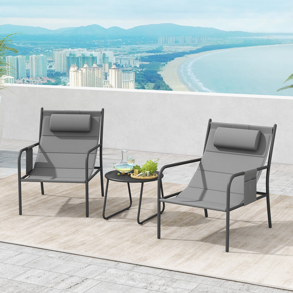 Two gray outdoor metal chairs with elastic headrests and a coffee table, perfect for backyard relaxation.