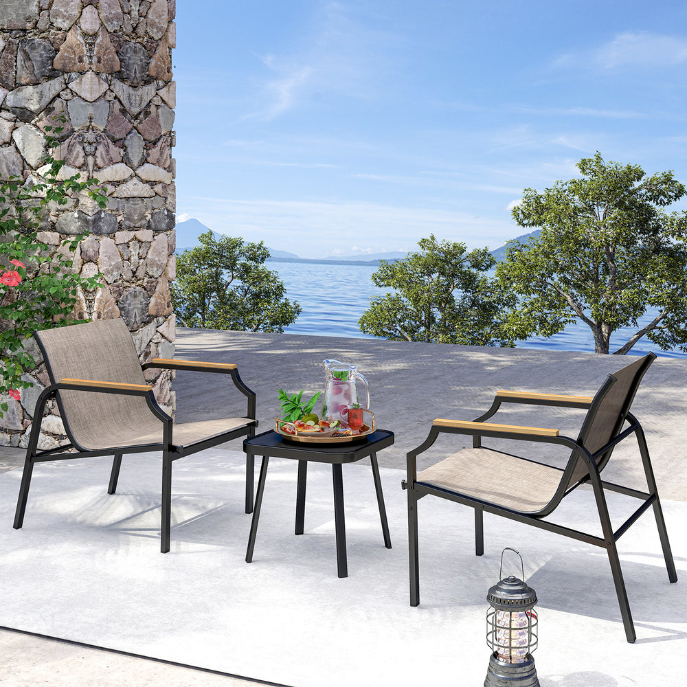 Two outdoor chairs with breathable fabric seats and a stylish side table, perfect for backyard relaxation.