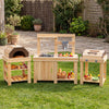 Natural wood pizza oven with thermometer and storage shelves in a 3-piece outdoor kitchen set for kids' imaginative cooking.