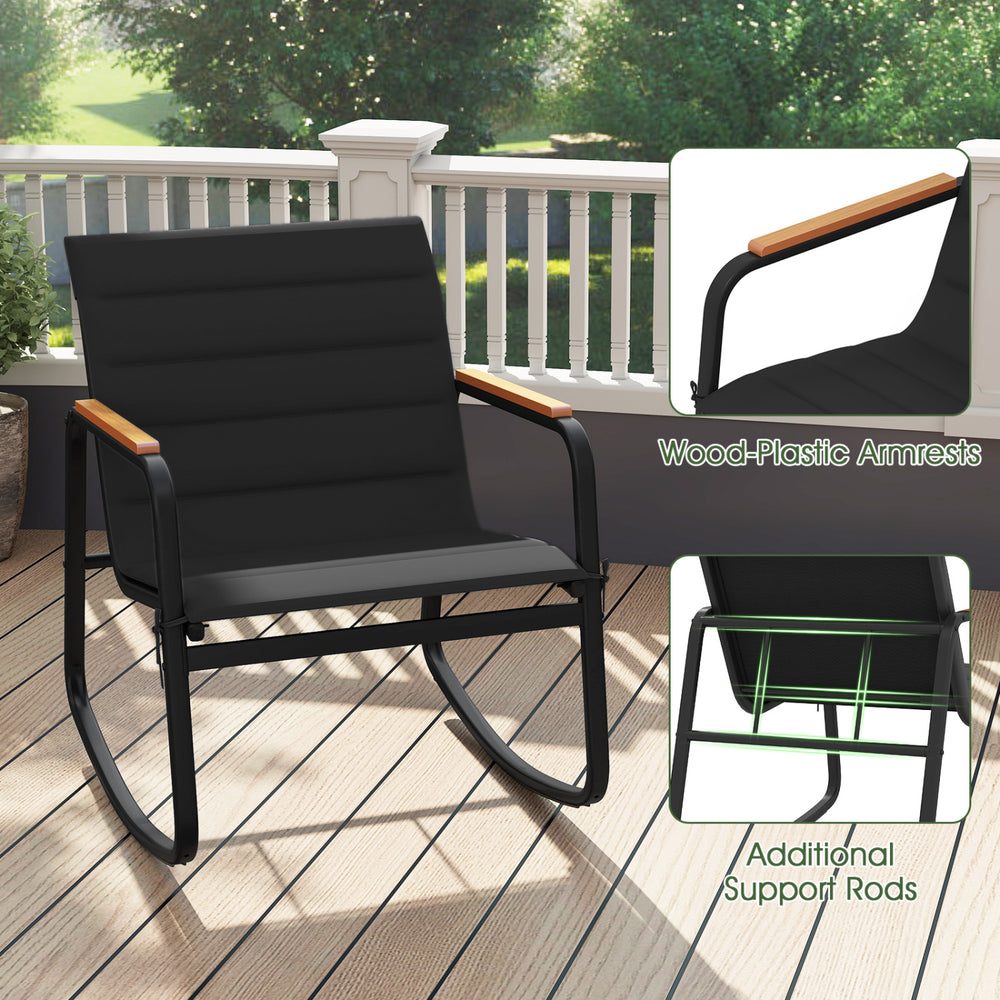 Black rocking chair from the 3 Piece Outdoor Rocking Bistro Set features wood-plastic armrests and a robust metal frame.