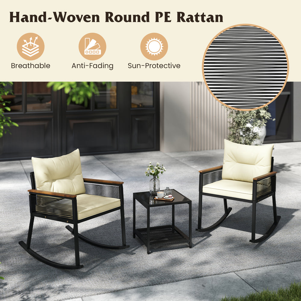 Two rocking chairs with cream cushions and a black coffee table, made of anti-fading PE rattan, perfect for outdoor use.