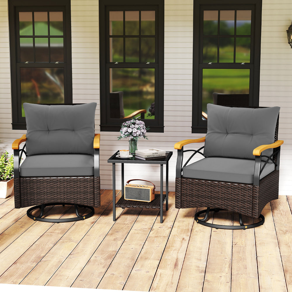 Two gray swivel chairs with acacia wood armrests and a tempered glass side table, perfect for outdoor relaxation.