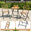 Folding round table and two chairs from the 3 Piece Patio Bistro Set with wicker seats, perfect for outdoor relaxation.