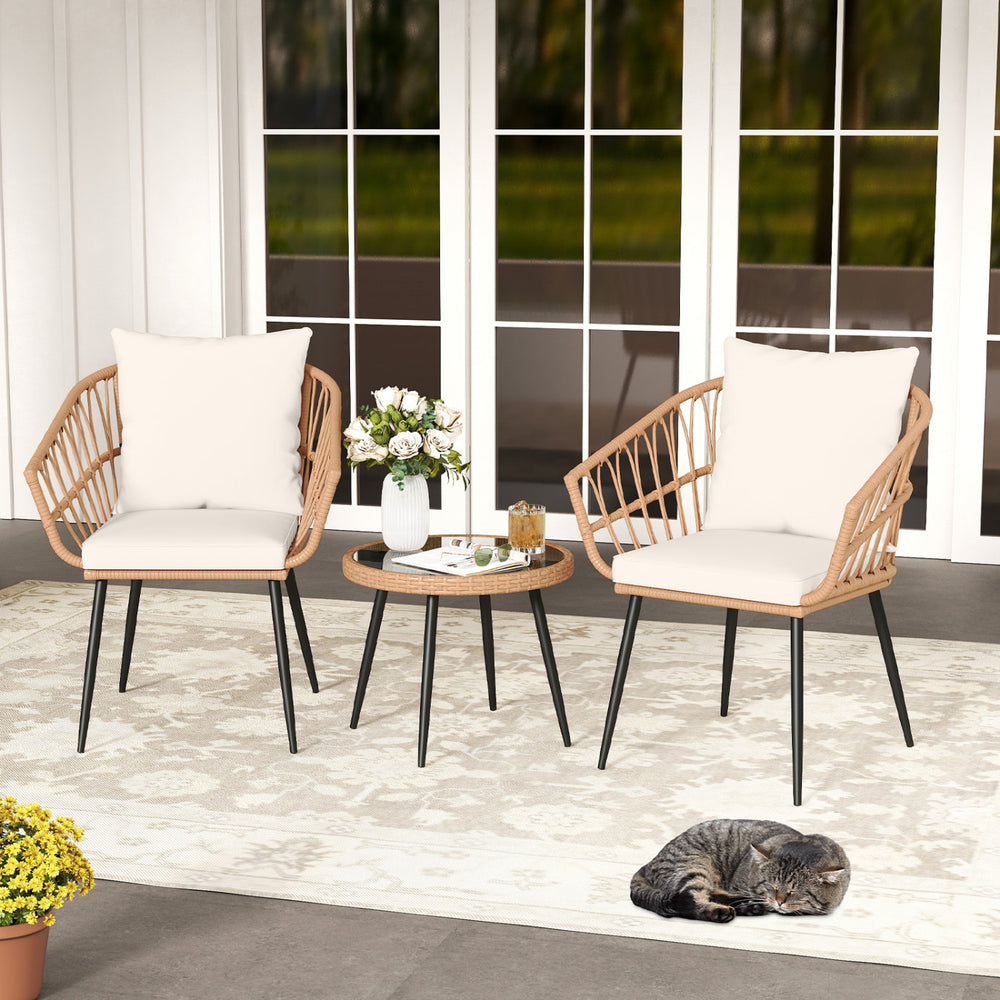 Three-piece patio bistro set featuring PE rattan wicker chairs and a tempered glass coffee table for outdoor relaxation.