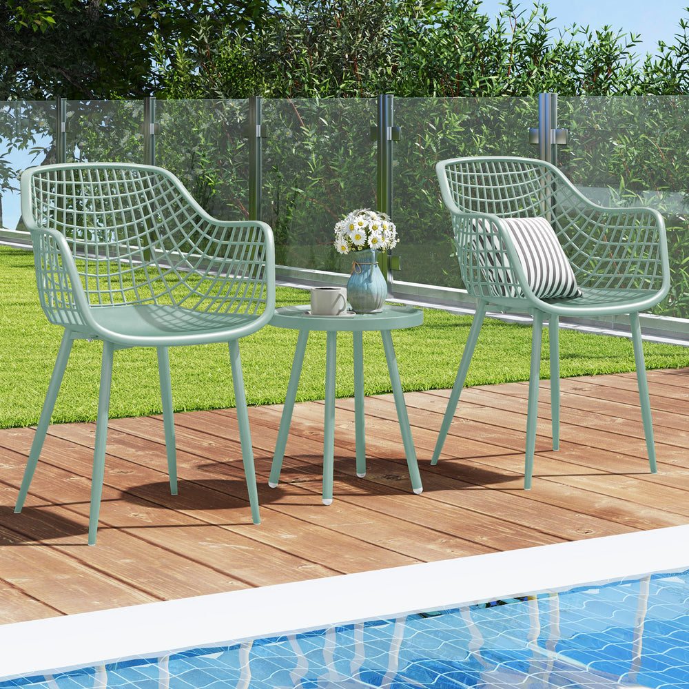 Two green patio chairs with a coffee table, featuring a PP seat and metal frame, perfect for poolside relaxation.