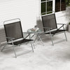 Two black folding patio chairs with a tempered glass coffee table, perfect for outdoor relaxation by the poolside.