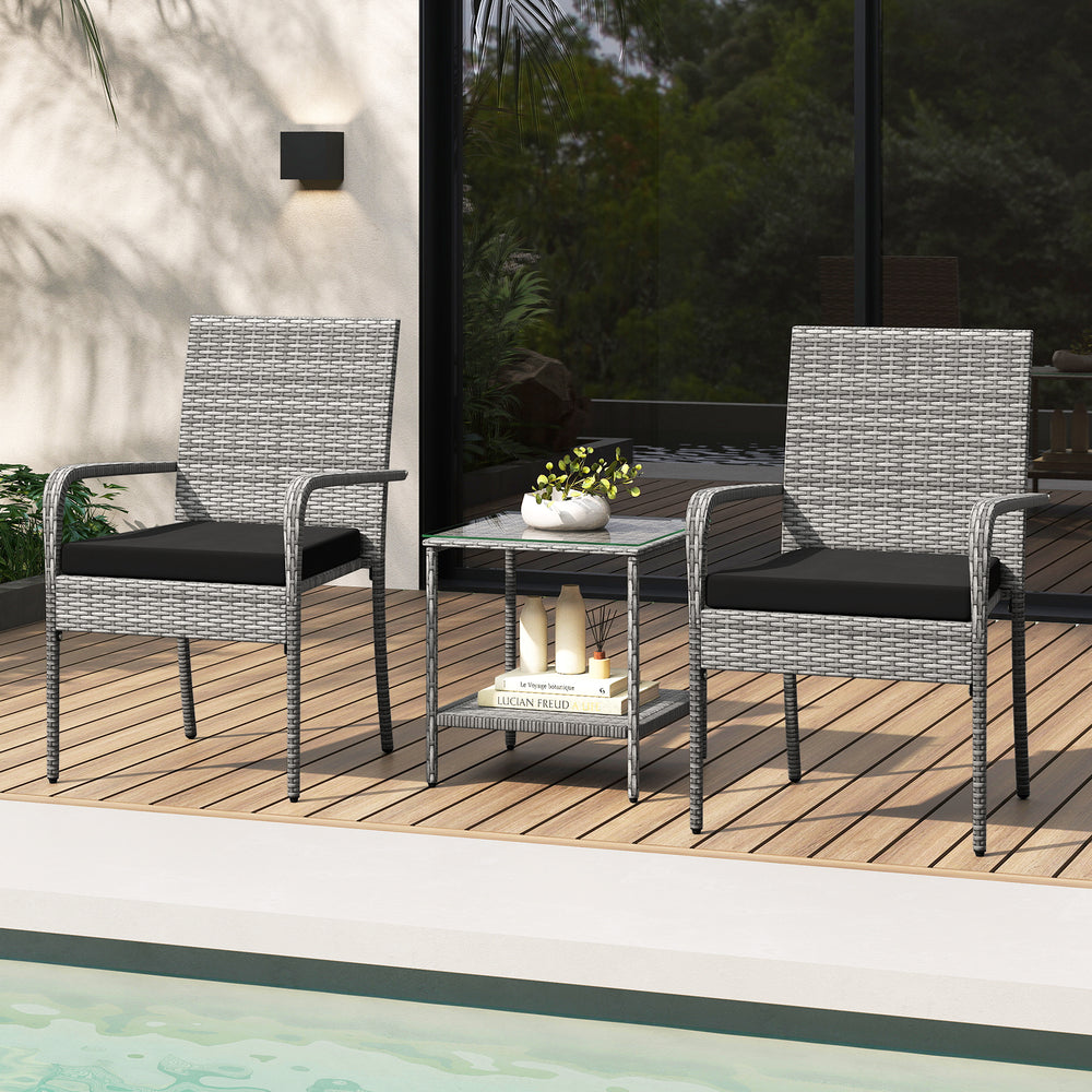 Two gray PE rattan chairs with black cushions and a tempered glass side table, perfect for balcony relaxation.
