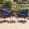 Rattan bistro chairs with navy cushions and a tempered glass side table, perfect for outdoor patio relaxation.