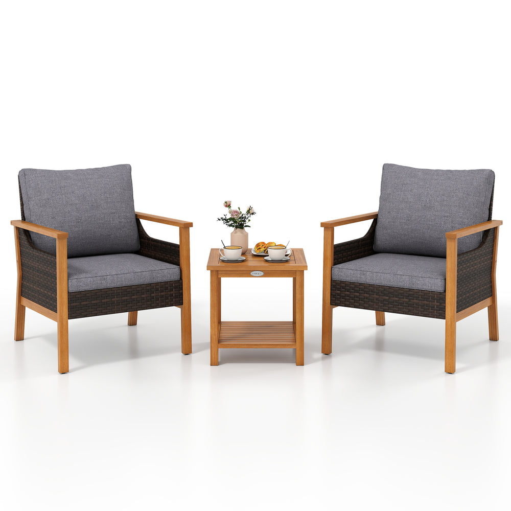 Two gray cushioned patio chairs with a slatted acacia wood side table, perfect for outdoor relaxation and gatherings.