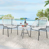Two white Acapulco chairs and a glass table in a patio setting, perfect for outdoor relaxation and entertaining.