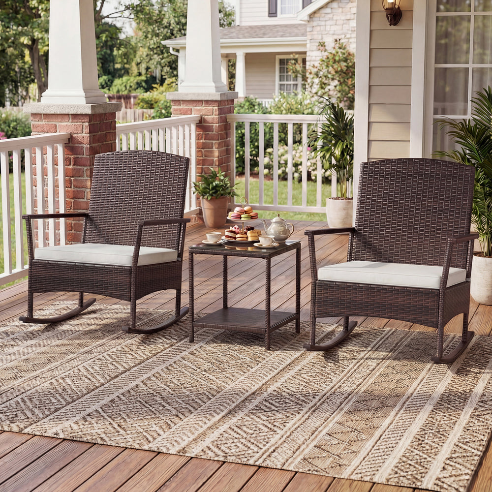Wicker rocking chairs with cushions and a 2-tier coffee table, perfect for outdoor relaxation on the patio.