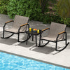 3-piece patio rocking bistro set with breathable fabric seats and tempered glass table, perfect for backyard relaxation.