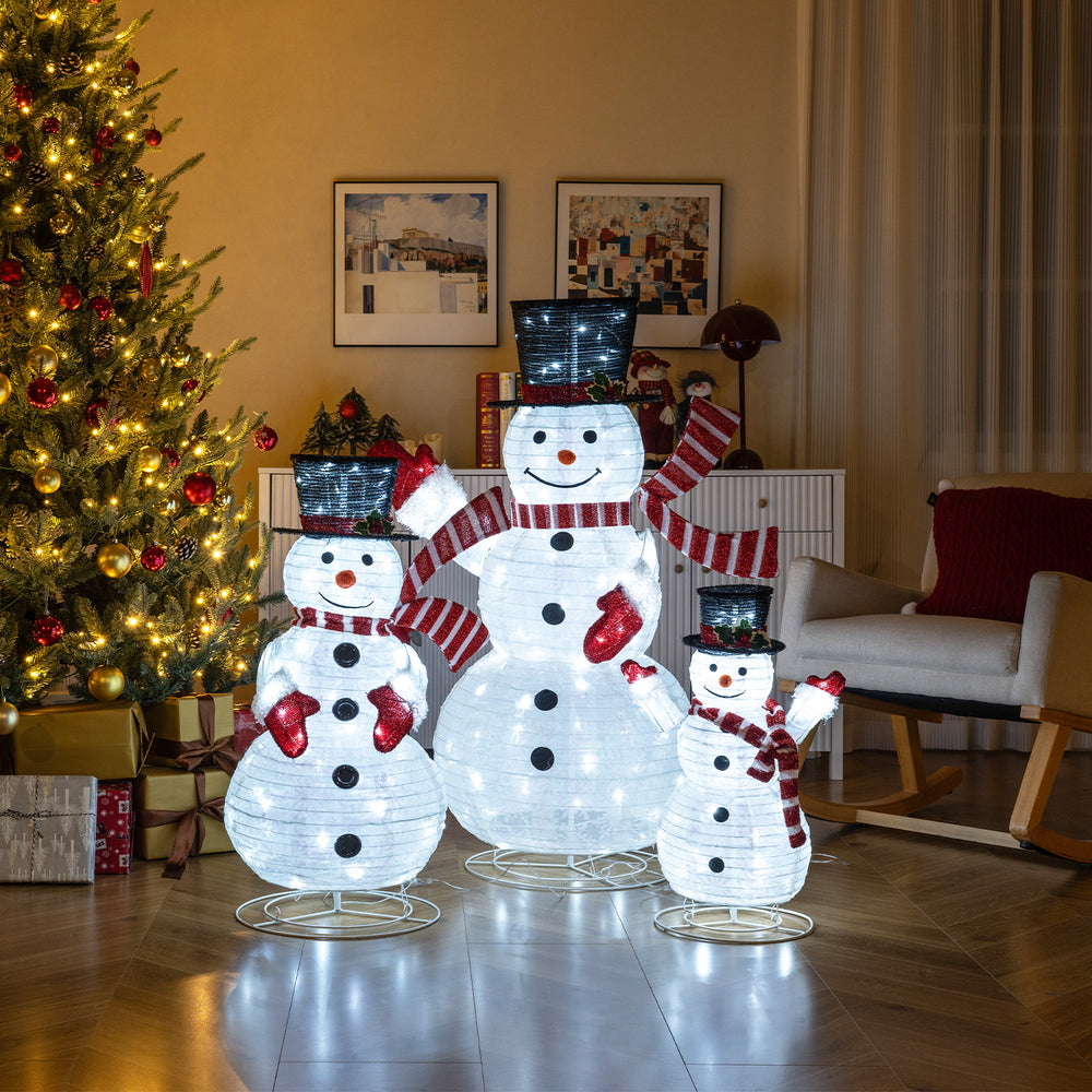 3-piece pre-lit 3D snowman set with 270 LED lights, featuring top hats, red scarves, and a sturdy metal frame for.