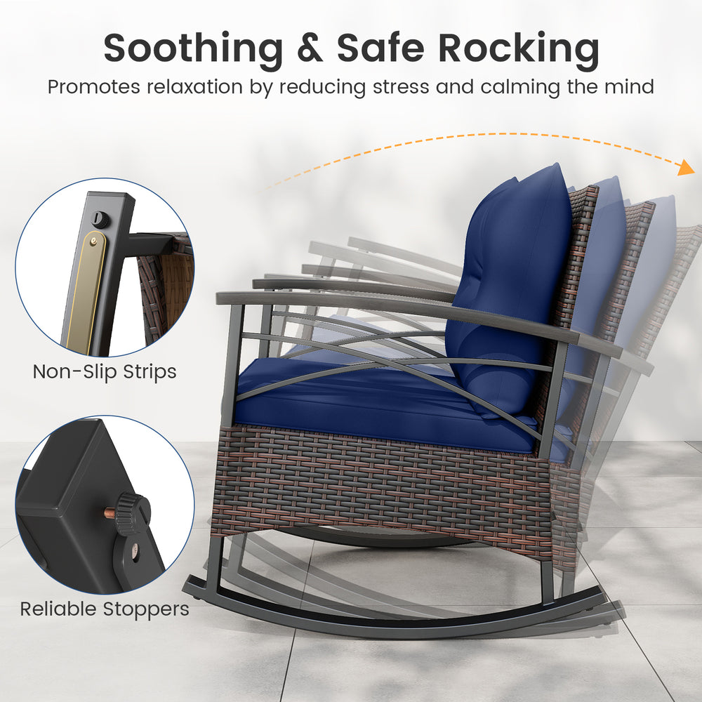 Navy cushion rocking chair with PE rattan and acacia wood, featuring anti-slip strips for safe relaxation on the patio.