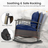 Navy cushion rocking chair with PE rattan and acacia wood, featuring anti-slip strips for safe relaxation on the patio.