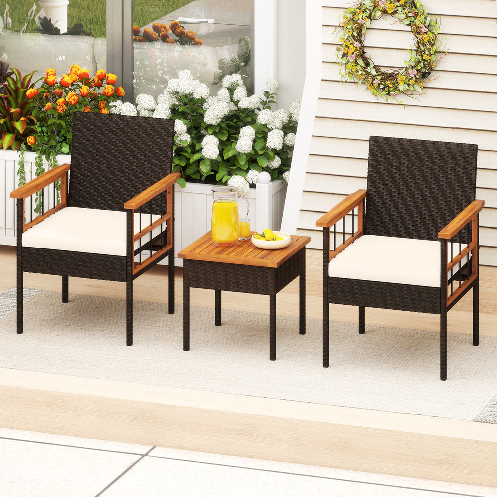 Wicker furniture set featuring acacia wood armrests and table, with soft cushions, perfect for balcony relaxation.