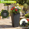 Tapered black wicker planter with robust metal frame and adjustable foot pads, perfect for garden or balcony use.