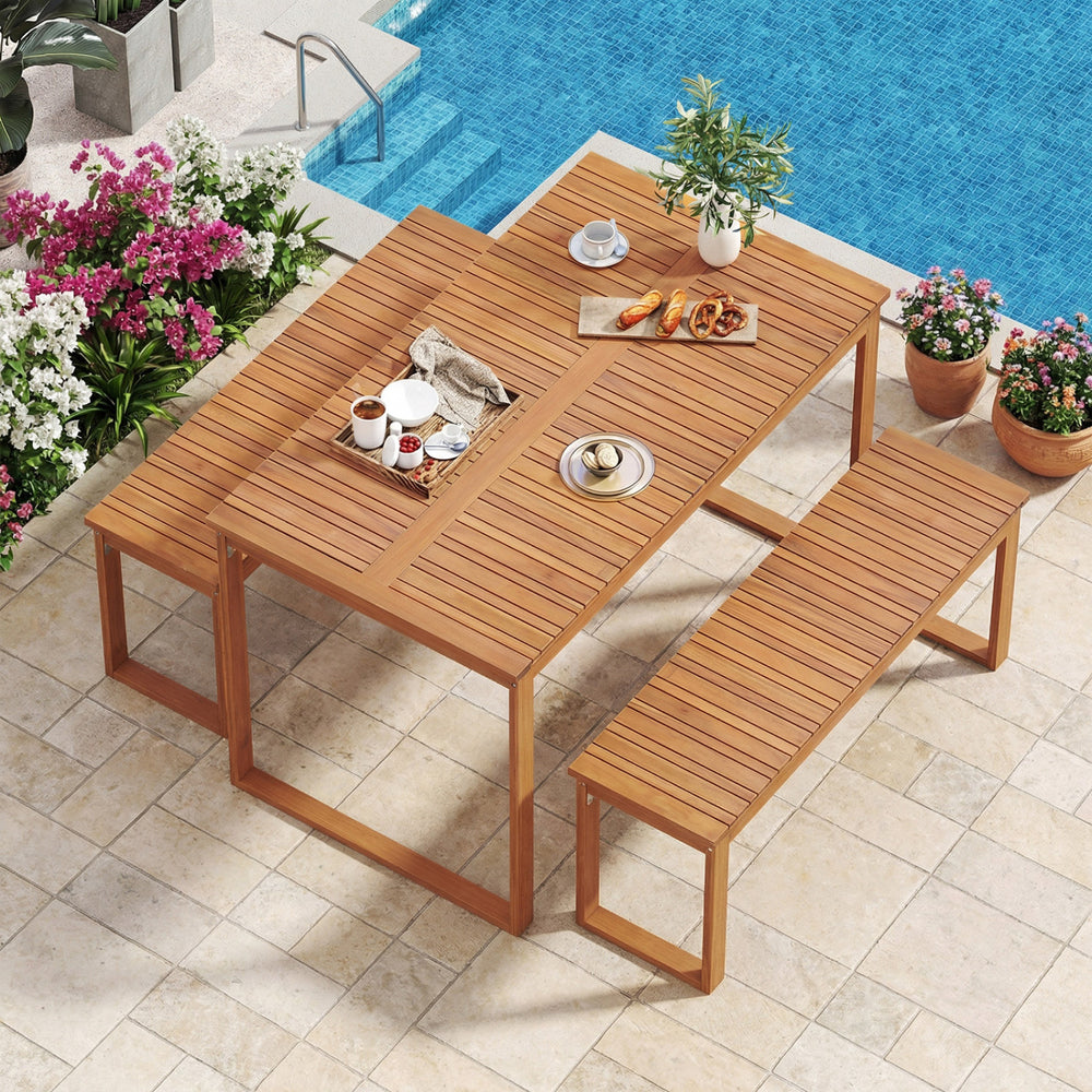 Acacia wood picnic set featuring a large outdoor dining table and two benches, ideal for patio or poolside use.