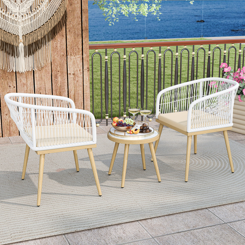 Two white PE wicker chairs and a round coffee table on a patio, ideal for outdoor bistro settings and small spaces.