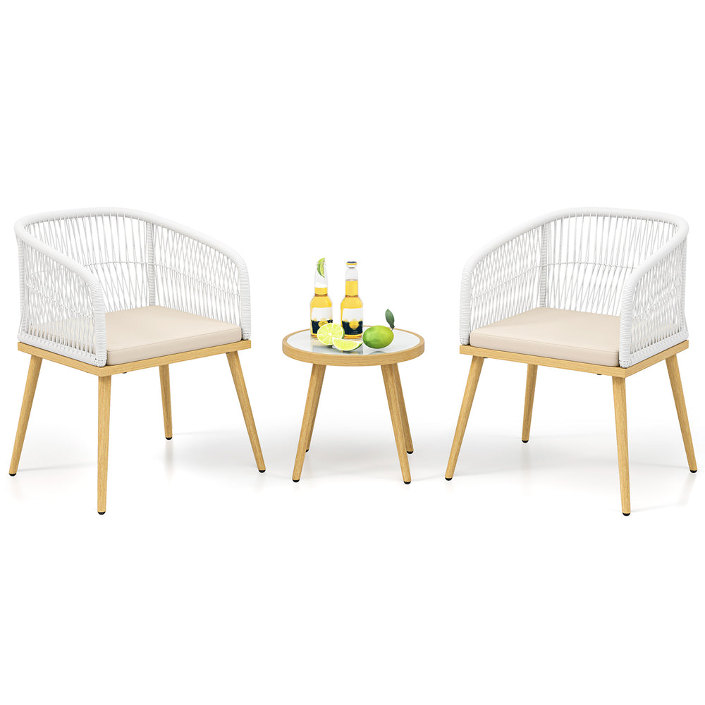 Two white PE wicker chairs with beige cushions and a round coffee table, ideal for outdoor bistro settings.
