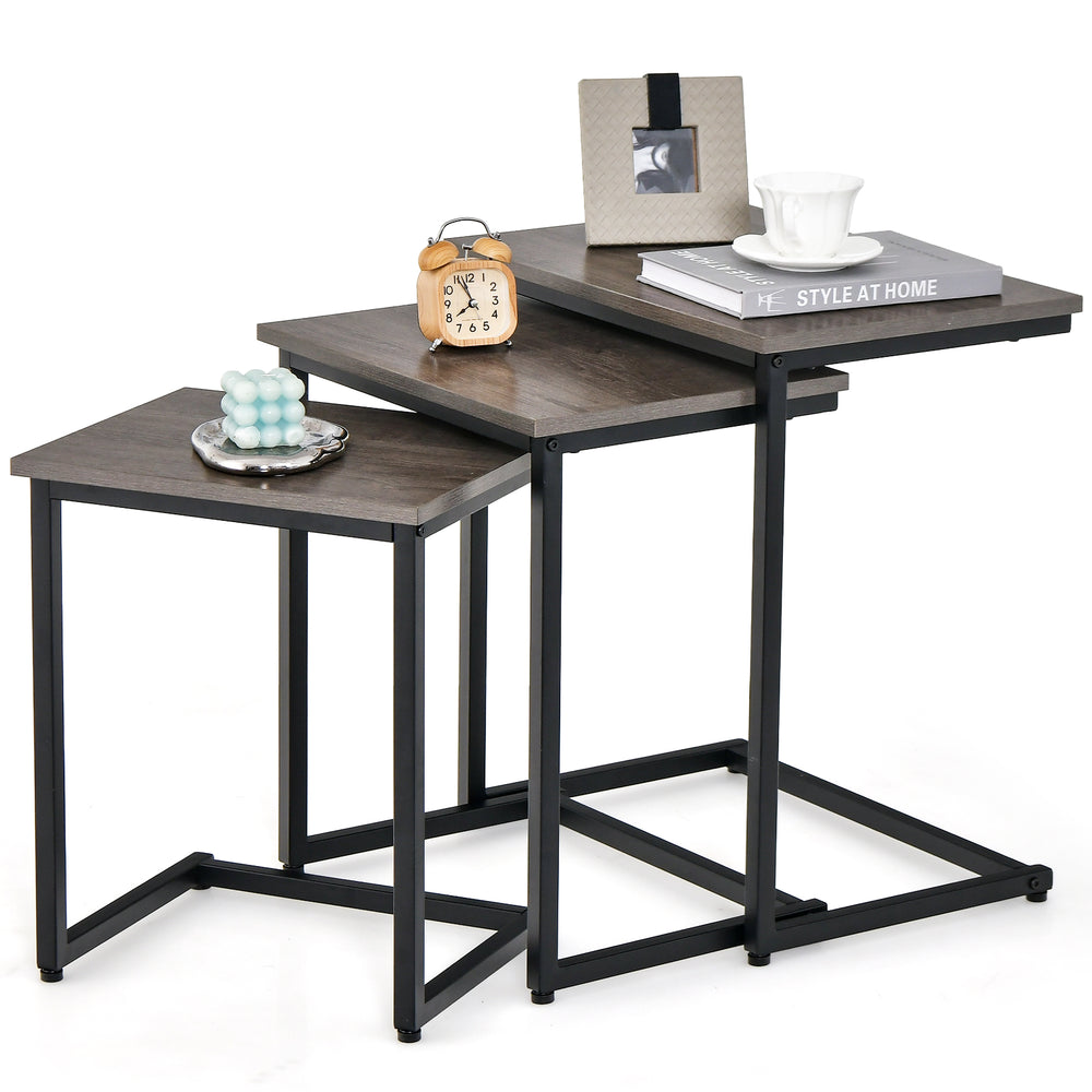 Set of 3 stackable coffee end tables in oak with steel tube structure, ideal for living room or office use.